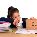 sweet little school girl bored under stress asking for help
